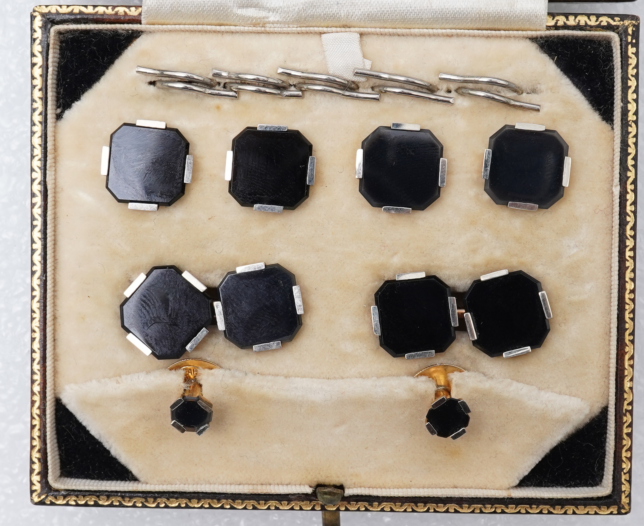 An Art Deco onyx dress set, early 20th century